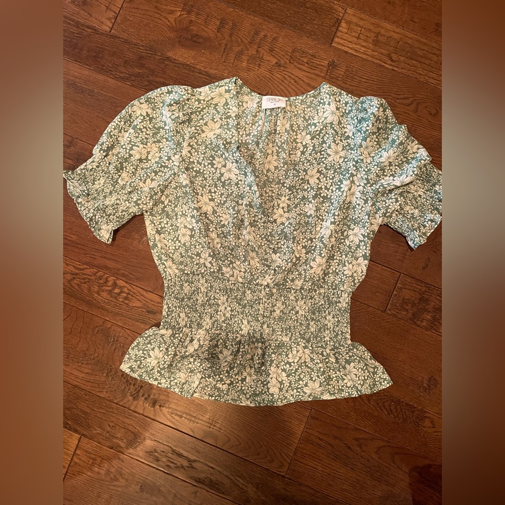 Sienna Sky green and white blouse, 100% polyester.
